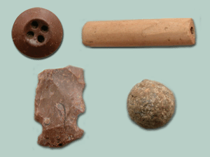 Brown Prosser button, Kaolin pipestem fragment, a side-notched projectile point, and lead shot